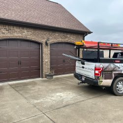 Best Door Co. technicians installing residential garage door in Florence AL