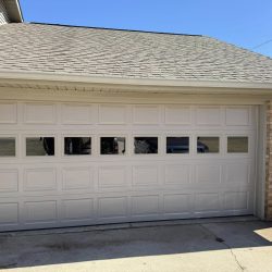 Large sectional garage door installed by Best Door Co. for a commercial building in Florence, Alabama